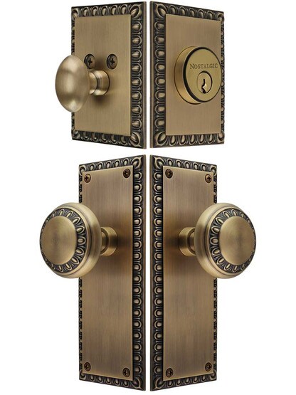 Ovolo Entry Door Set, Keyed Alike with Matching Knobs in Antique Brass.